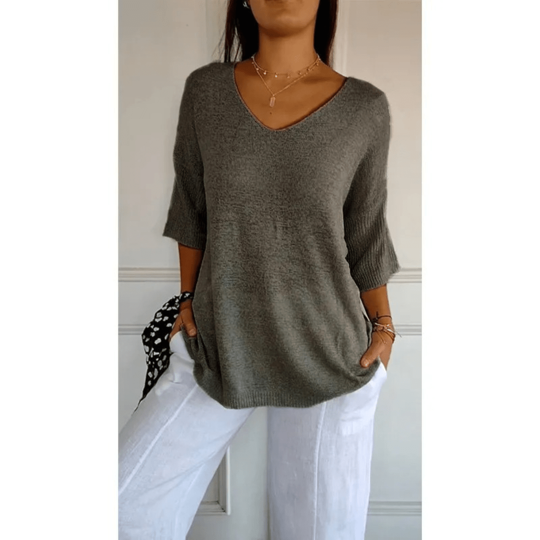 Essential women's V-neck top with 3/4 sleeves, offering comfort and a relaxed fit for versatile wear.