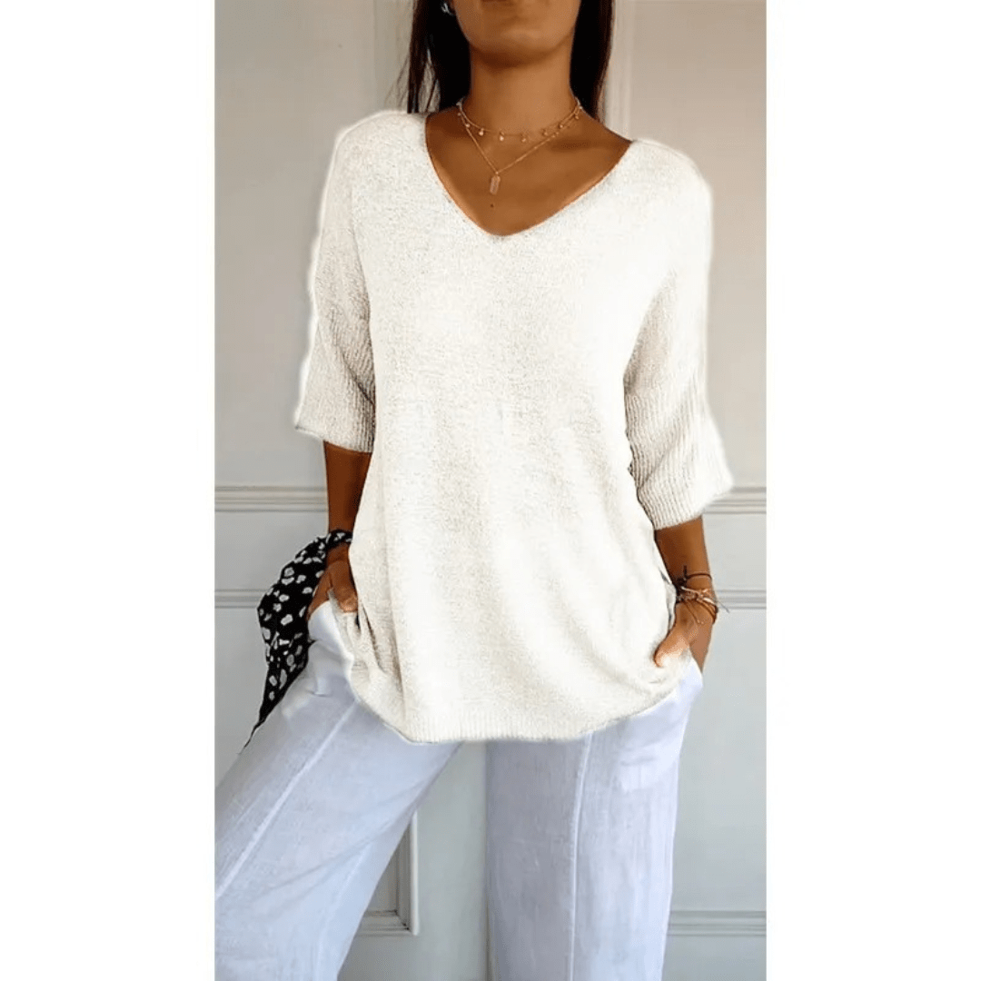 Women's relaxed fit V-neck top, 3/4 sleeve. Effortless comfort for any casual, everyday occasion.