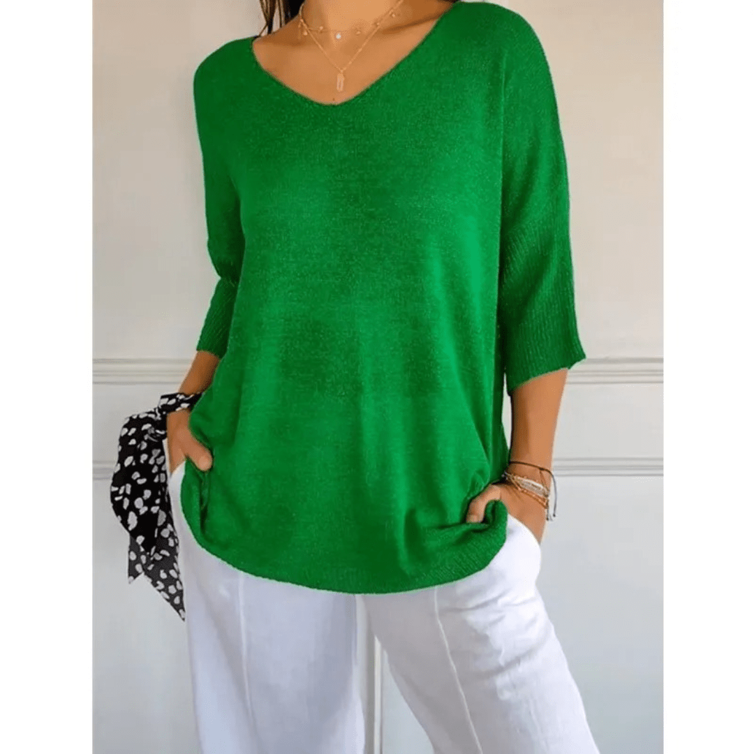 Stylish women's clothing: V-neck 3/4 sleeve top, comfortable & versatile for a relaxed everyday look.