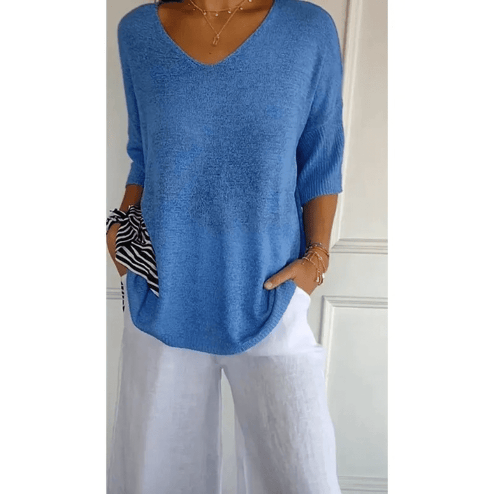 Versatile women's V-neck blouse, 3/4 sleeve, ensuring all-day comfort & effortless style.