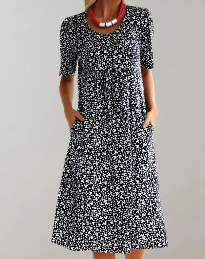 Relaxed fit women's flowy V-neck summer dress. Casual, comfortable, and perfect for vacation or everyday.