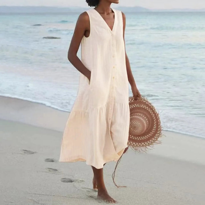 Chic women's button-front V-neck midi dress, ideal for summer beachwear or elegant day outfits. Flowy comfort.