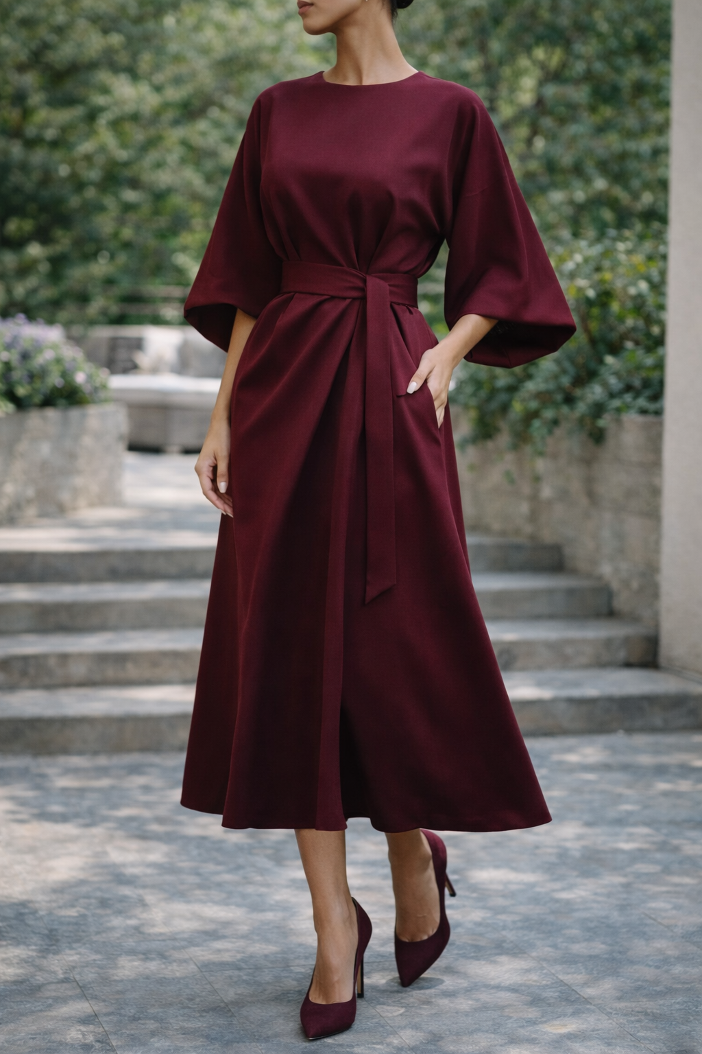 Women's effortlessly chic belted midi dress with wide sleeves, perfect for elegant day or evening wear.