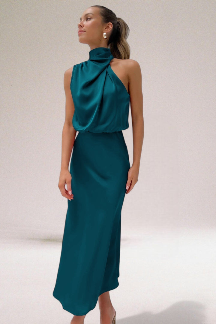 Light green Elara elegant flowing maxi dress for women, featuring a chic halter neck. Ideal wedding guest dress.