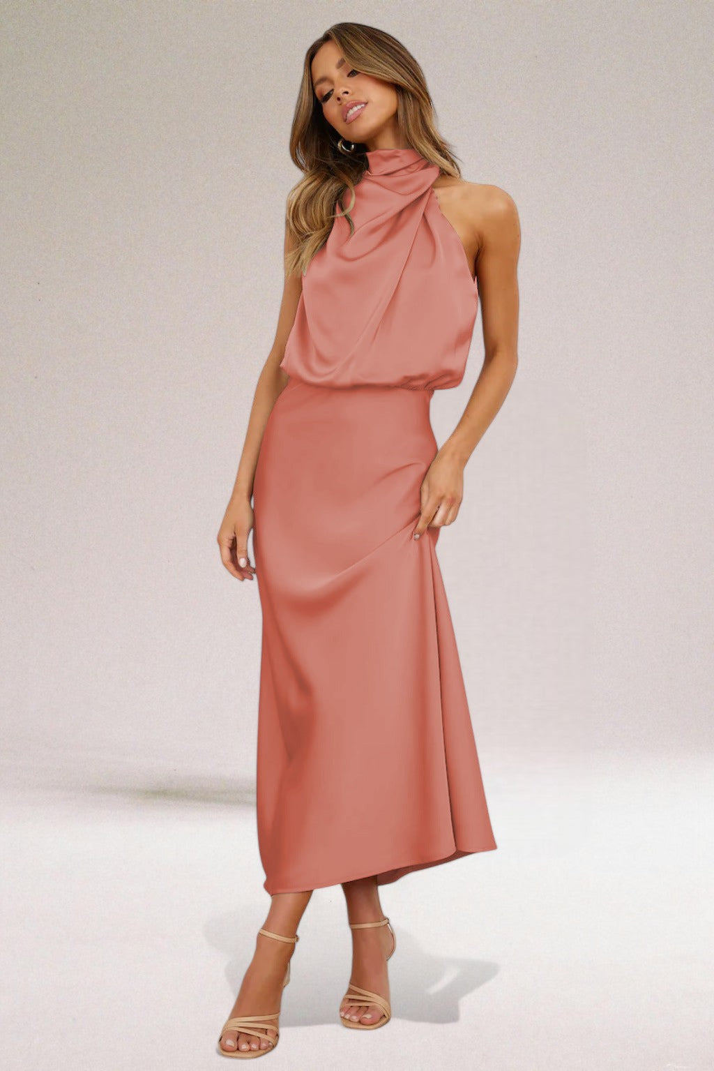 Navy blue Elara women's elegant formal dress, a flowing maxi gown with a sophisticated halter neck design.