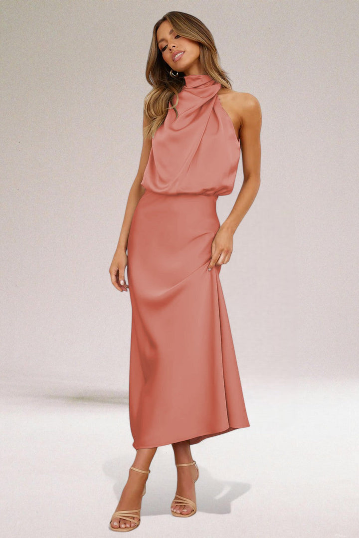 Navy blue Elara women's elegant formal dress, a flowing maxi gown with a sophisticated halter neck design.