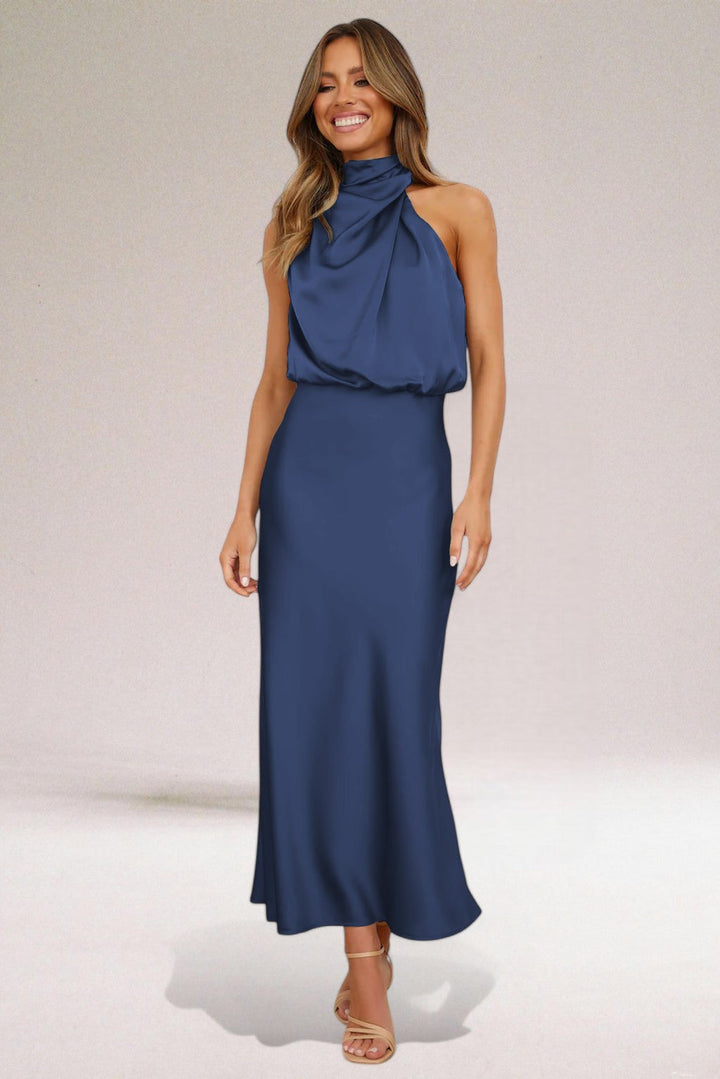 Beige Elara women's elegant flowing evening dress, a sophisticated long halter neck gown for special events.
