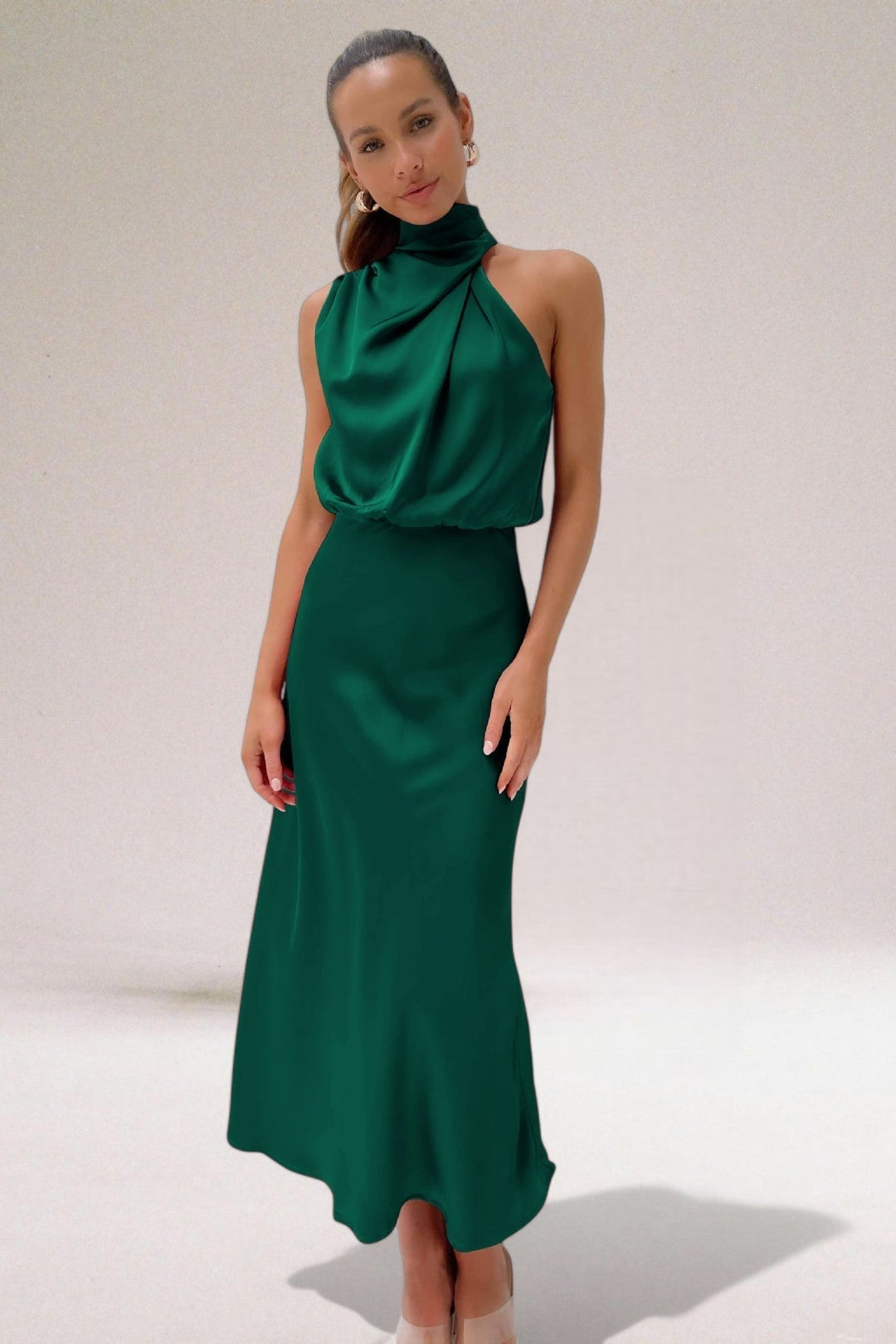 Sophisticated Elara women's flowing evening gown, a long formal halter neck dress perfect for wedding guests & parties.