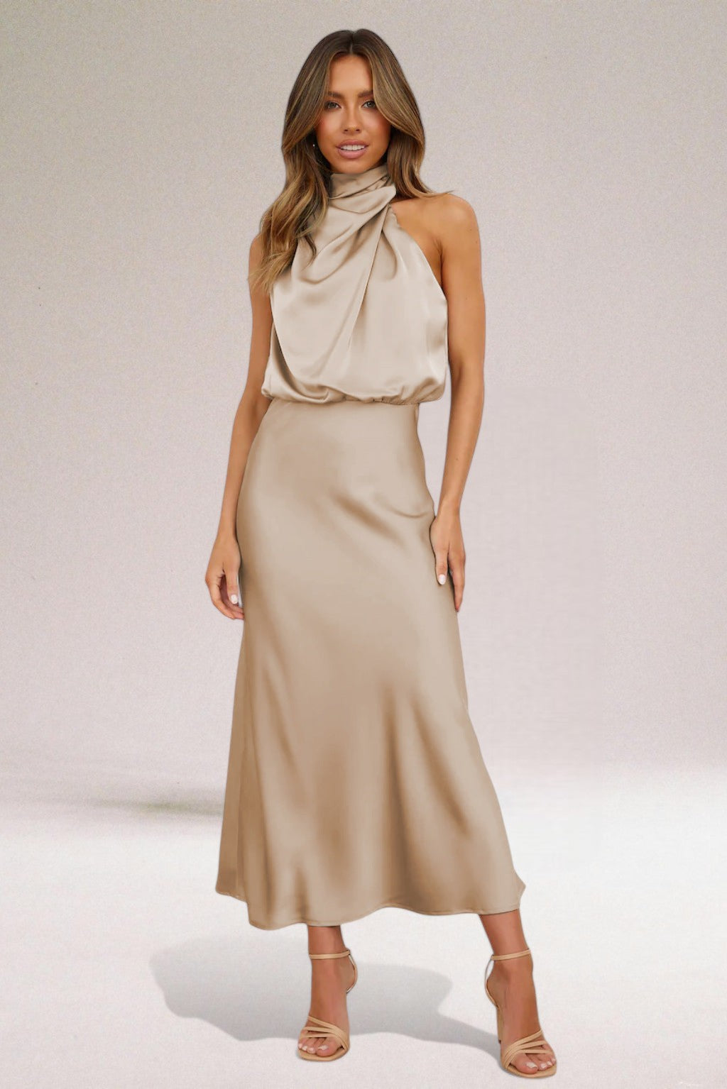 Elara women's elegant flowing maxi dress in light green, navy, or beige, with a graceful halter neck. Special occasion.