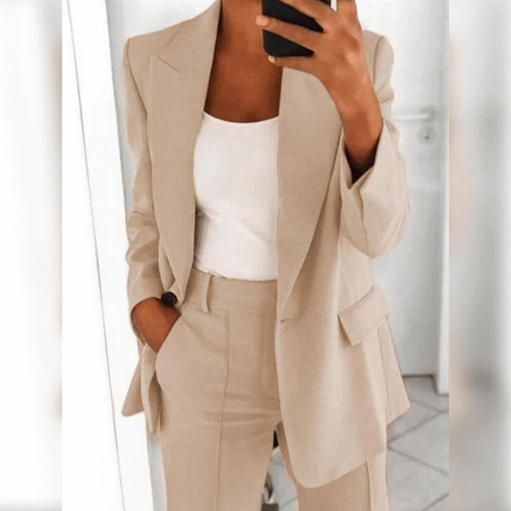 Tailored women's formal suit: an elegant blazer and matching pants, ideal for business and office clothes.