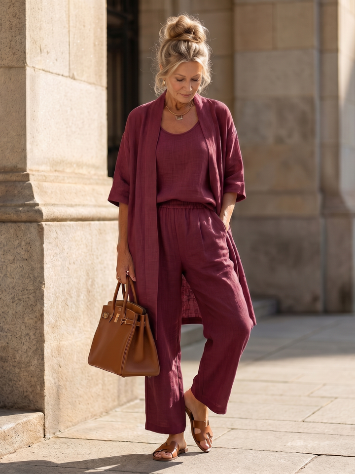 Elegant women's loungewear set with a longline cardigan, wide-leg pants & a sleeveless top for spring.