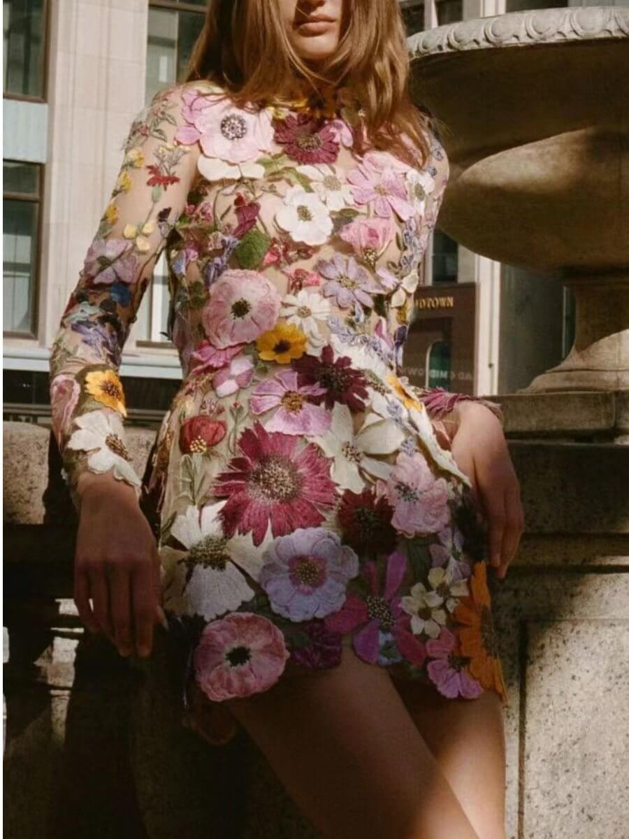 Close-up of a women's exquisite 3D floral embroidery detail on an elegant all-season dress.