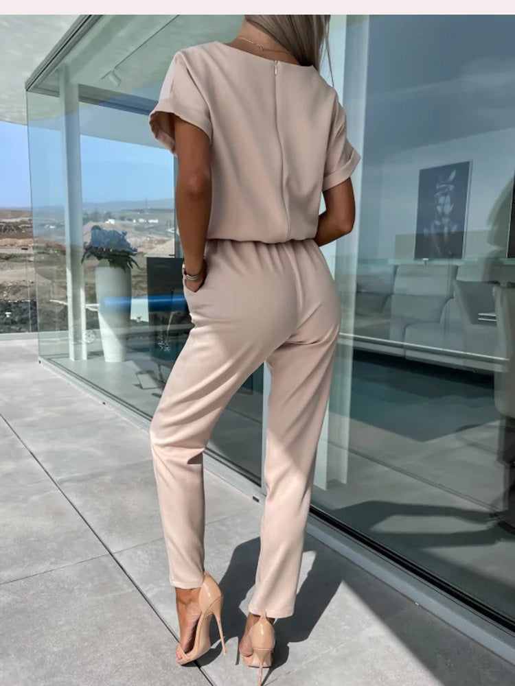 Stylish women's jumpsuit with wide legs and a belt, creating a versatile and chic fashion outfit.