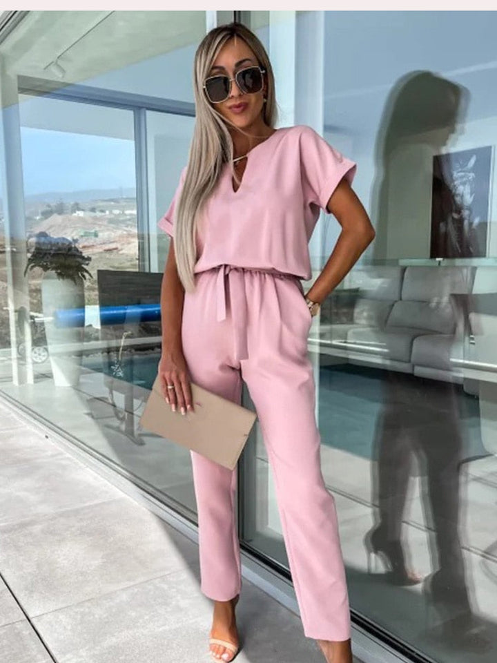 Chic women's wide-leg jumpsuit with belt, offering effortless style and versatility for any occasion.