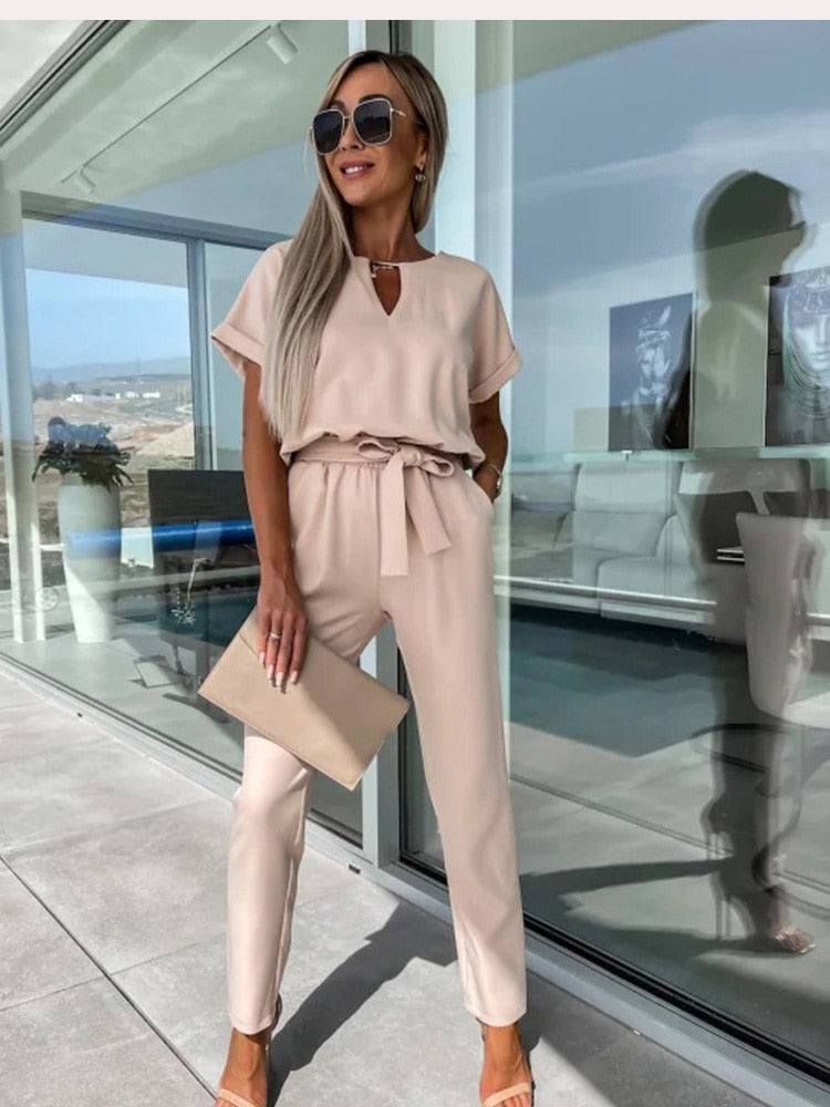 Comfortable women's belted jumpsuit featuring a stylish wide-leg design for modern fashion.