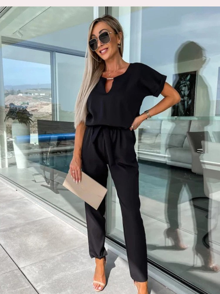 Elegant women's belted wide-leg jumpsuit, a versatile outfit for a sophisticated fashion look.
