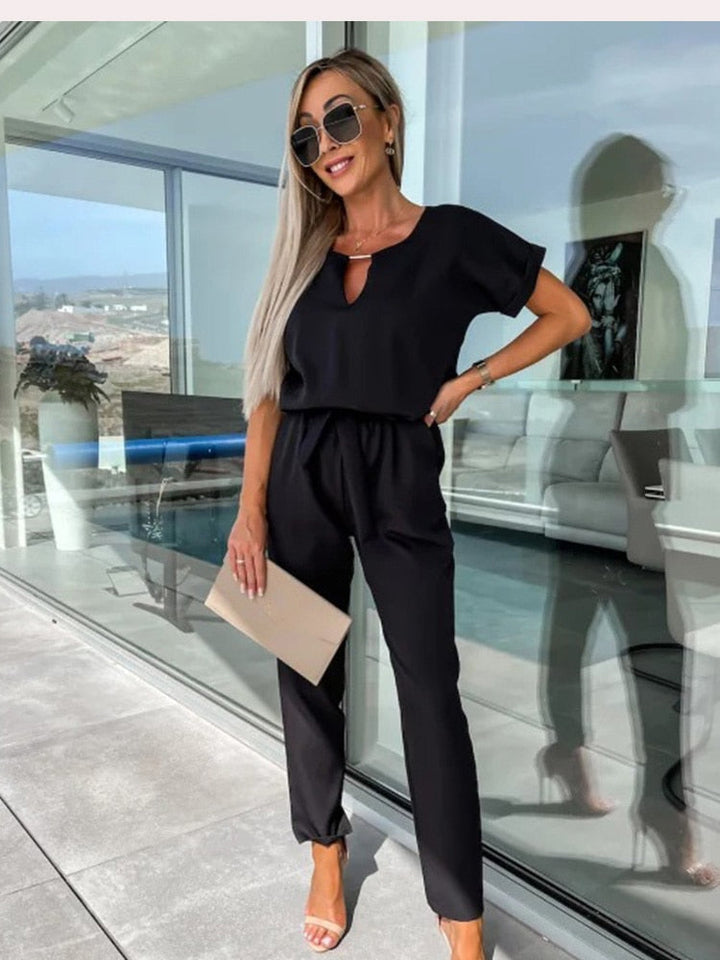 Elegant women's belted wide-leg jumpsuit, a versatile outfit for a sophisticated fashion look.