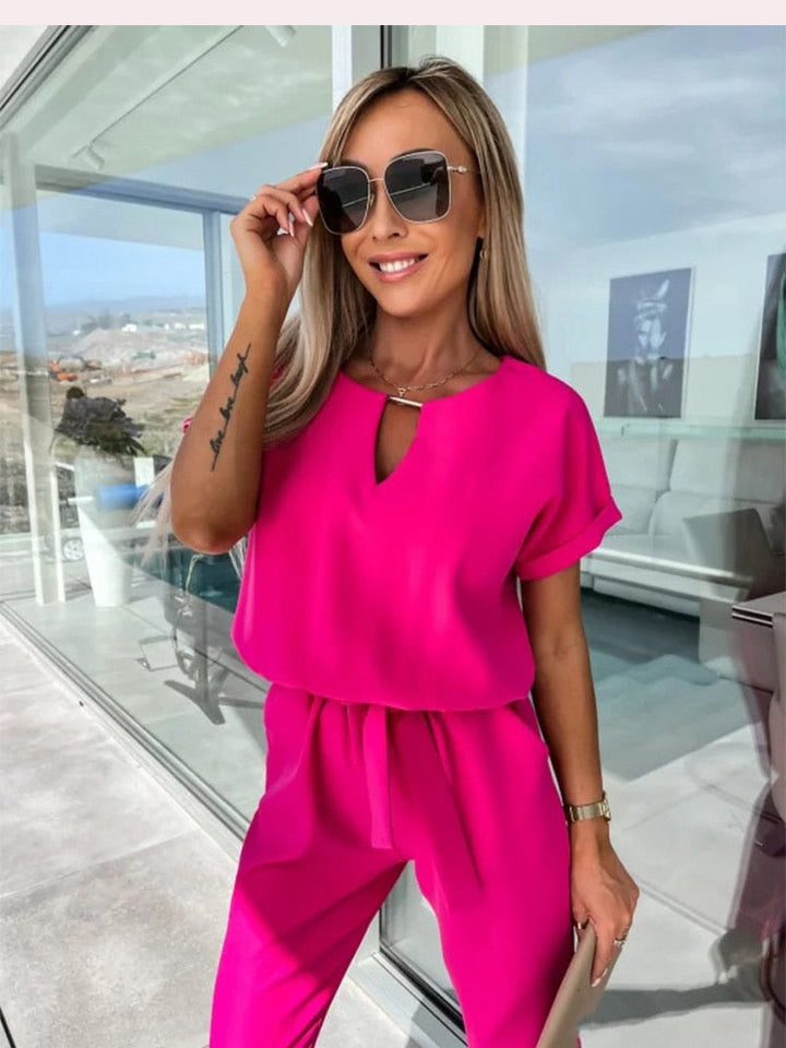 Versatile women's belted wide-leg jumpsuit, ideal for comfortable yet elegant everyday wear.