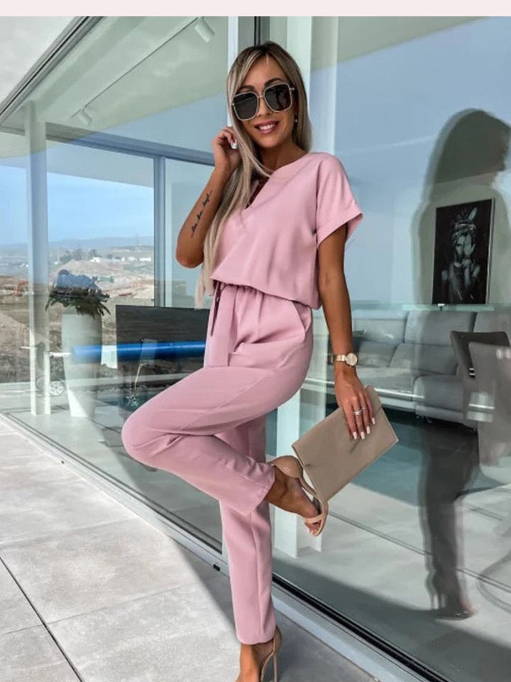 Effortless style with this women's wide-leg jumpsuit, featuring a flattering belt detail.