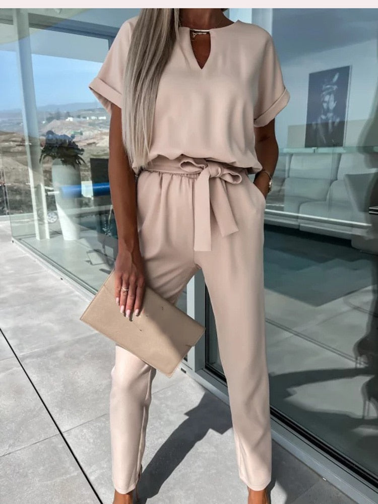 Elegant belted jumpsuit for women, designed with a wide-leg for ultimate comfort and style.