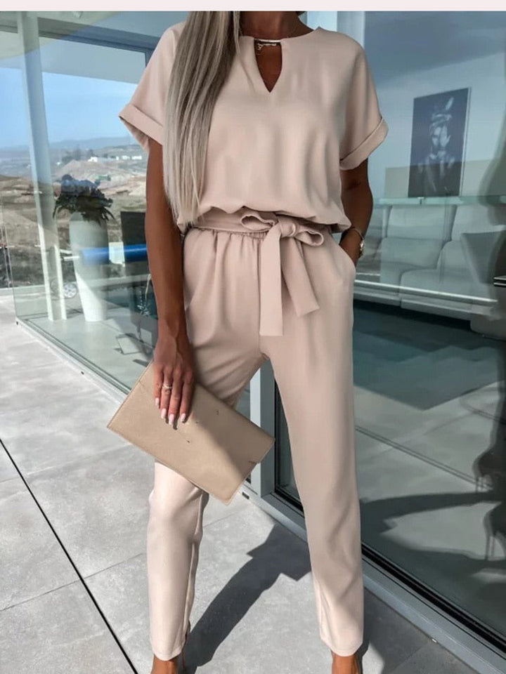Elegant belted jumpsuit for women, designed with a wide-leg for ultimate comfort and style.
