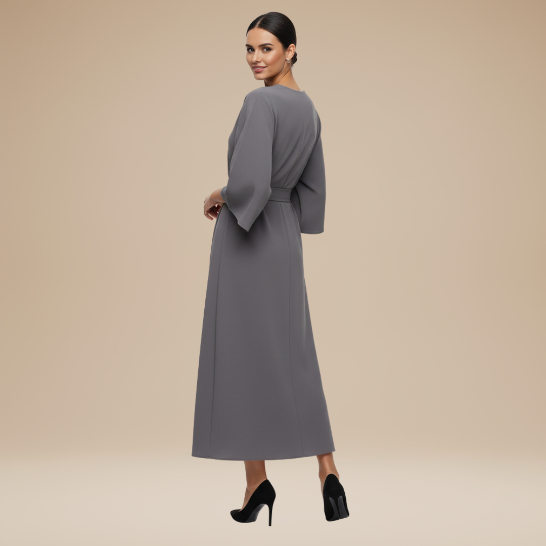 Flattering wrap front detail on a women's elegant long sleeve midi dress, perfect for formal and party wear.