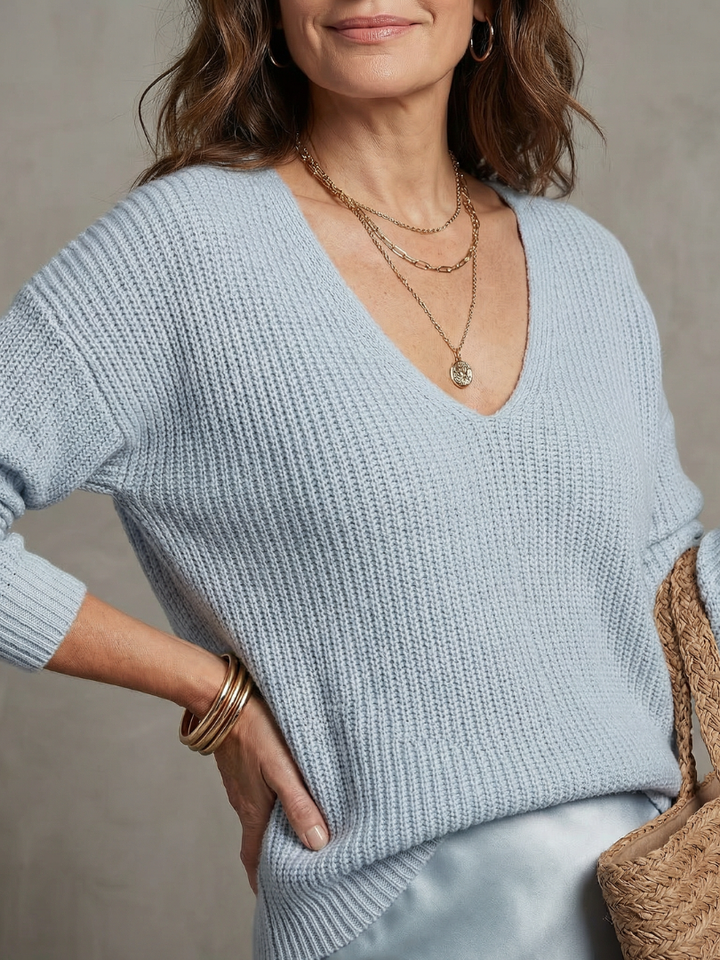 Elegant women's outfit: V-neck long sleeve top & bias midi skirt. Ideal for layering this fall.