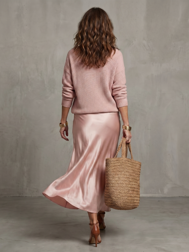 Comfortable women's matching set featuring a V-neck long sleeve top & elegant bias midi skirt.
