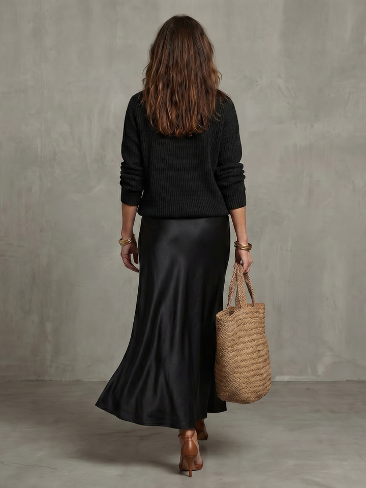 Women's two-piece elegant set: a long sleeve V-neck top & a flowing bias cut midi skirt.