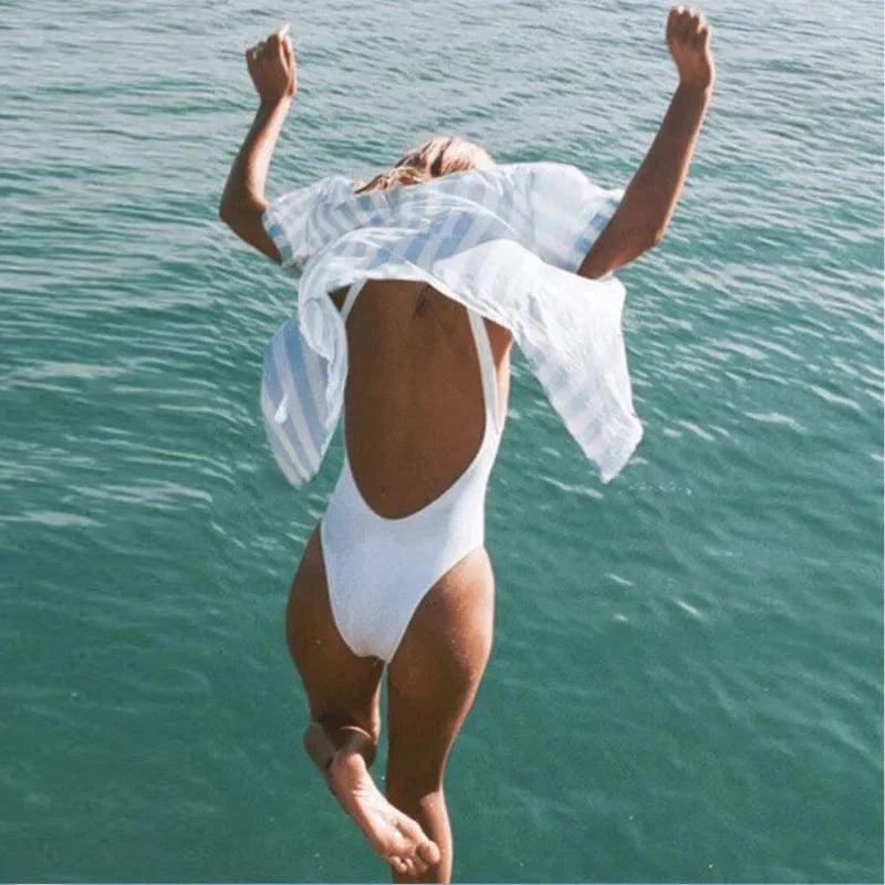 Minimalist women's one-piece swimsuit with elegant backless design. Comfortable swimwear for summer.