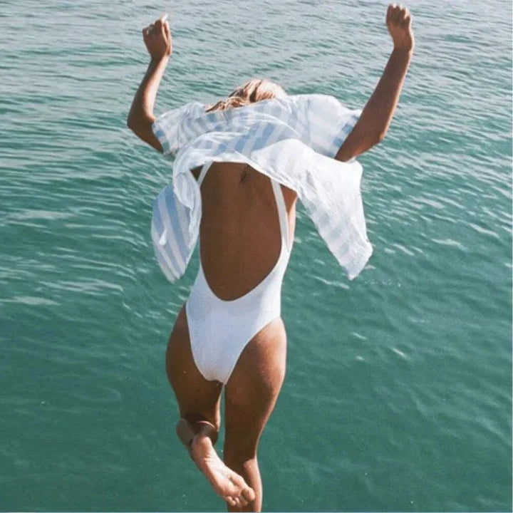 Minimalist women's one-piece swimsuit with elegant backless design. Comfortable swimwear for summer.