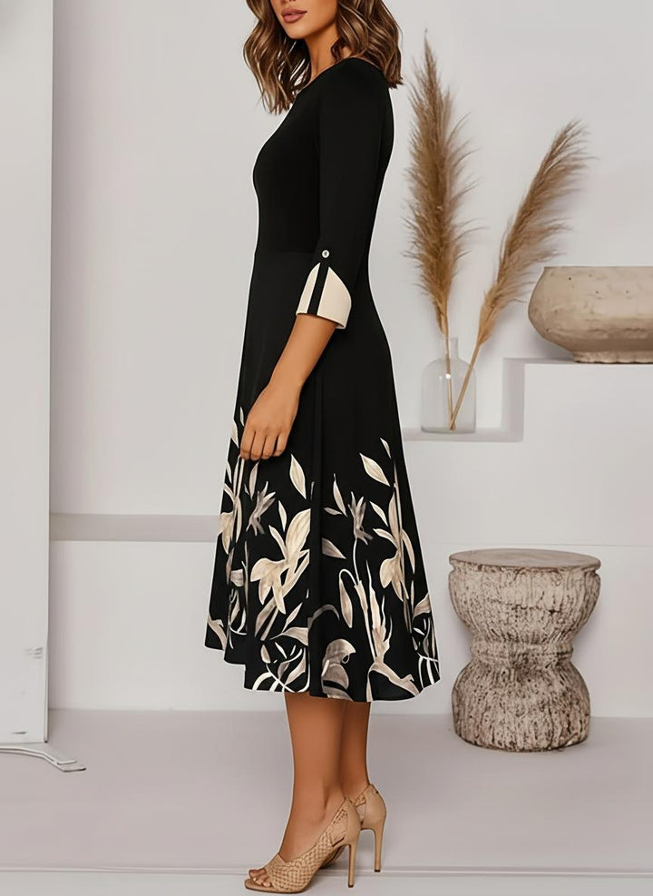 Elegant floral A-line midi dress for women, featuring three-quarter sleeves. Ideal as a formal evening or wedding guest dress.