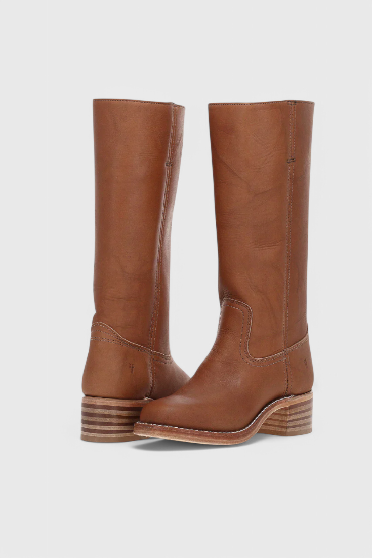 Stylish women's slip-on knee-high boots with elegant heel, perfect for winter chic.