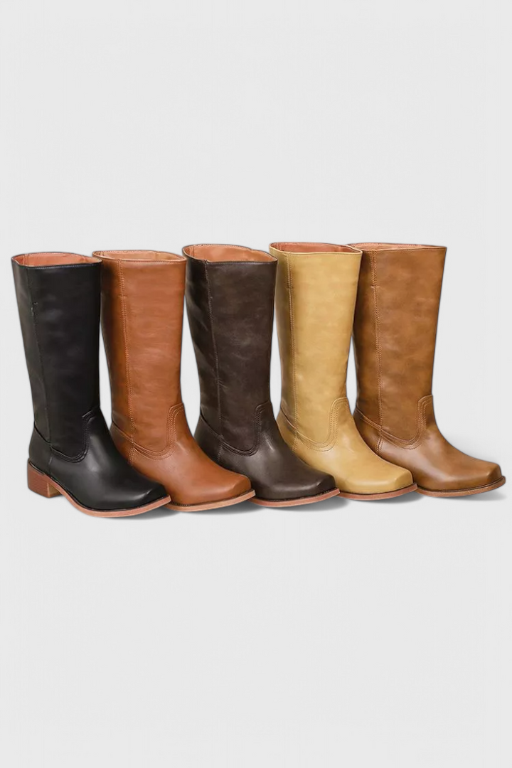 Sleek ladies' knee-high leather boots with an elegant block heel, perfect for fall fashion.