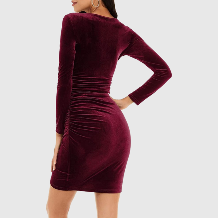 Flattering ruched mini party dress for women, featuring an elegant V-neck & long sleeves. Ideal for special occasions.
