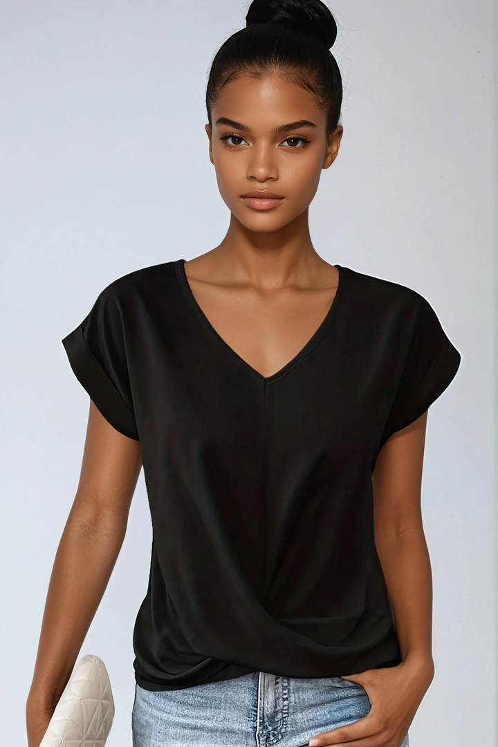 Chic black V-neck blouse for women. Relaxed fit, short sleeve. Ideal for casual, work, or evening fashion.