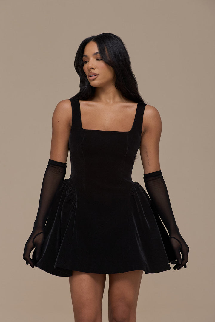 Women's elegant black velvet mini dress with a square neckline, perfect for evening parties & cocktails.
