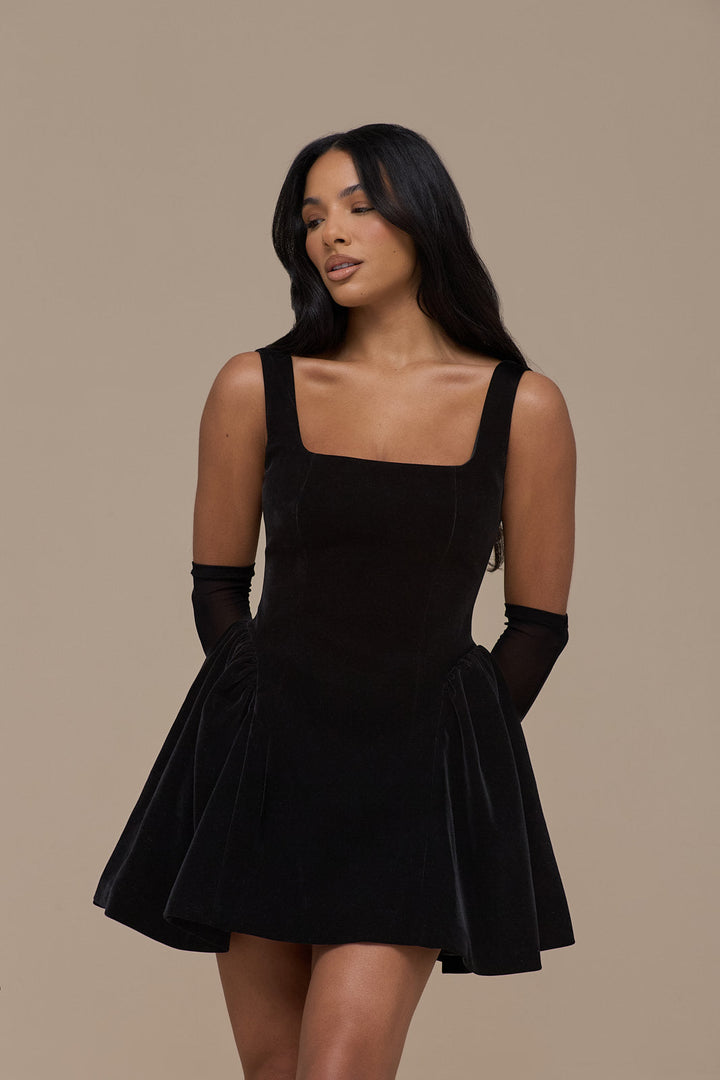 Elegant women's black velvet mini dress with a chic square neckline, suitable for evening functions.