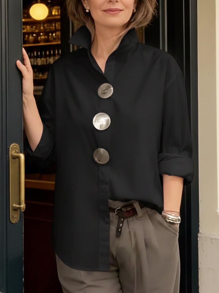 Stylish women's blouse with a unique big button collar, a modern take on an elegant and comfortable top.