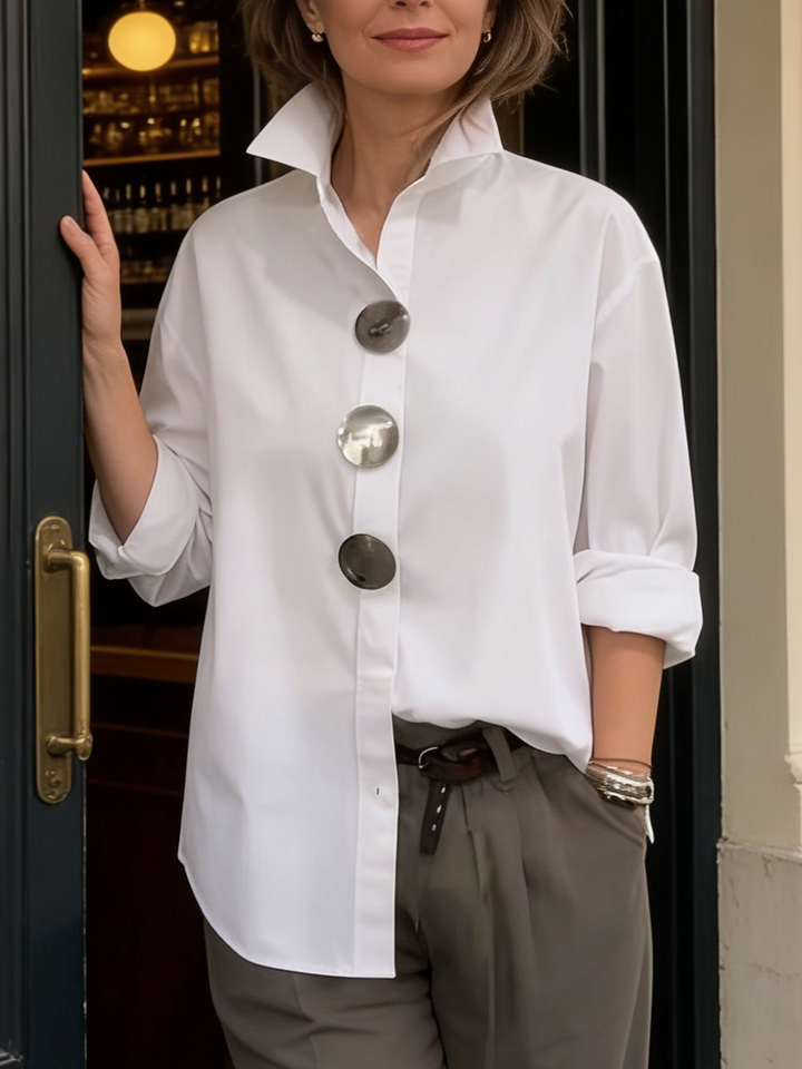 Elegant women's workwear blouse with a distinct big button collar, a chic addition to any professional wardrobe.
