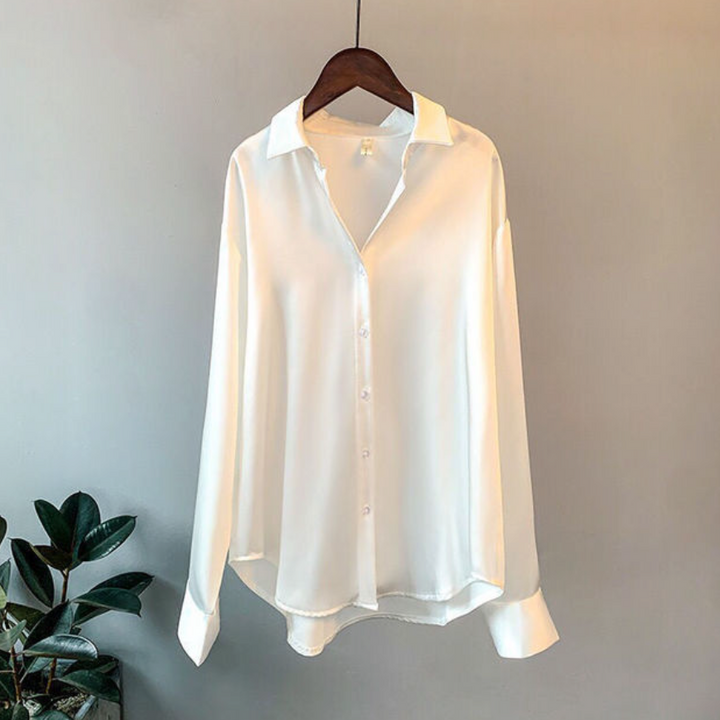 New women's professional blouse featuring a classic collar, long sleeves & loose fit. Timeless ladies fashion.