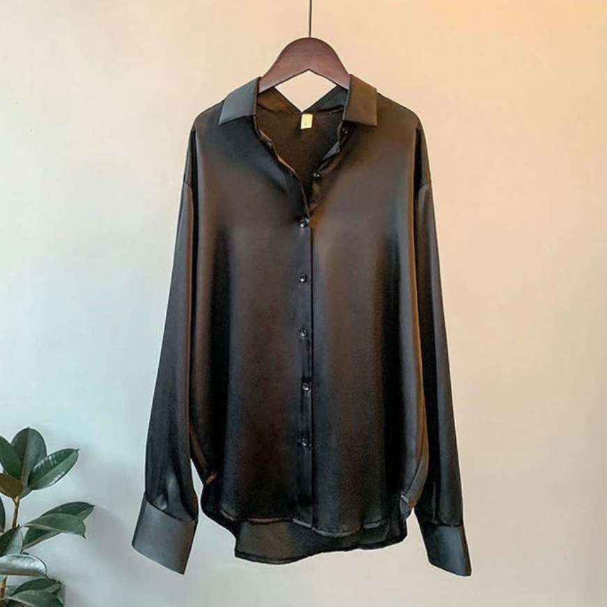 Elegant women's button-up blouse, long sleeves, classic collar. Ideal versatile top for office wear & sophisticated style.
