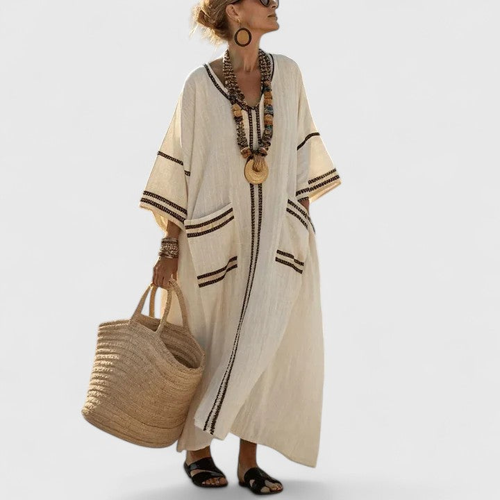 Women's elegant bohemian maxi dress with V-neck, flowy fabric, perfect for summer casual & vacation.