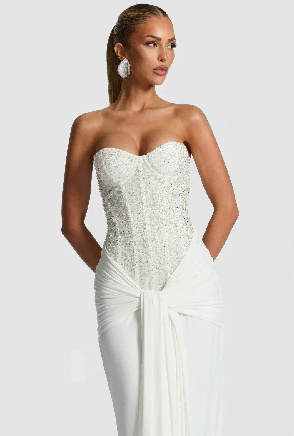 Red strapless corset maxi evening gown for women, an elegant formal dress for special occasions.