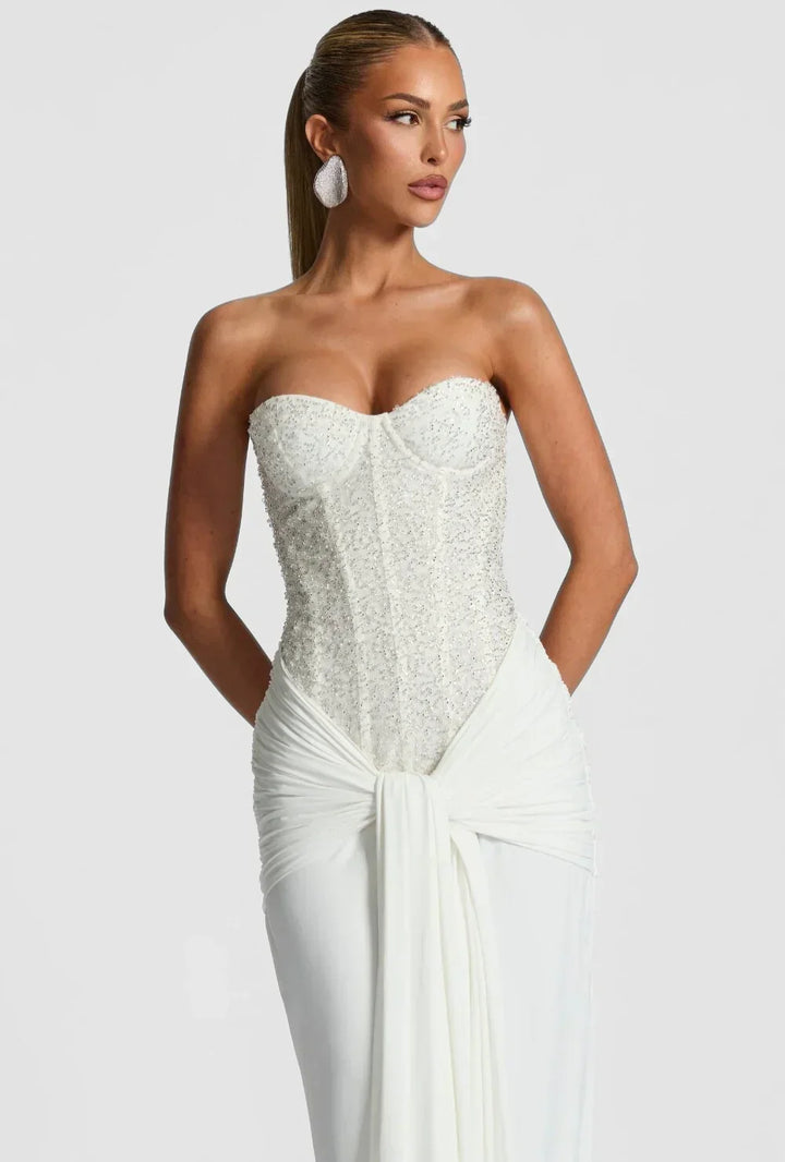 Red strapless corset maxi evening gown for women, an elegant formal dress for special occasions.