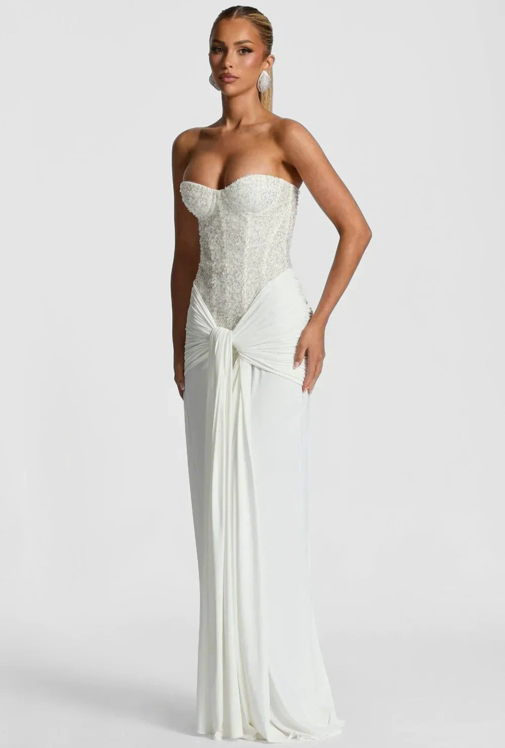 Pink elegant strapless corset maxi dress, ideal women's wedding guest or party attire.