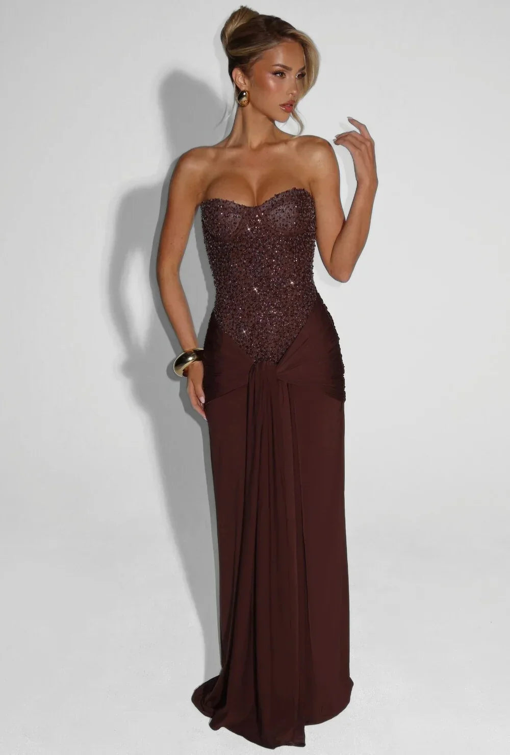 Pink women's elegant strapless maxi dress, corset design, perfect for evening parties.