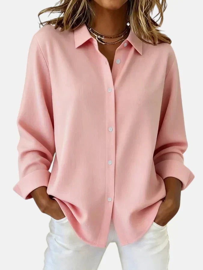 Close-up of elegant women's blouse featuring a stylish button collar & comfortable long sleeves.