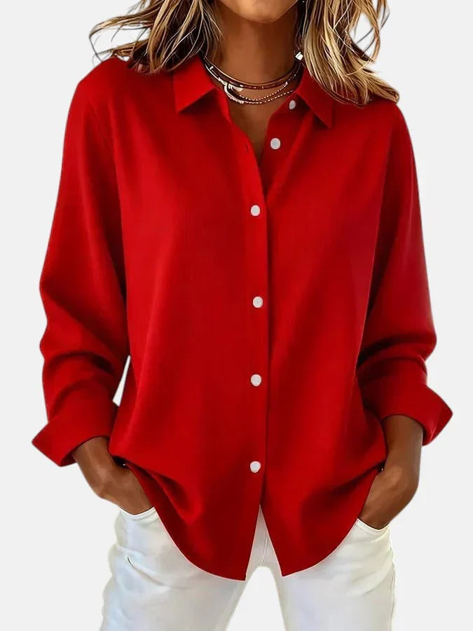 Stylish women's long-sleeve blouse with elegant button-up collar. Versatile fashion for comfort & style.