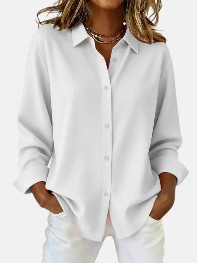 Comfortable women's button-collar blouse. Elegant long-sleeve top for versatile fashion & stylish wear.